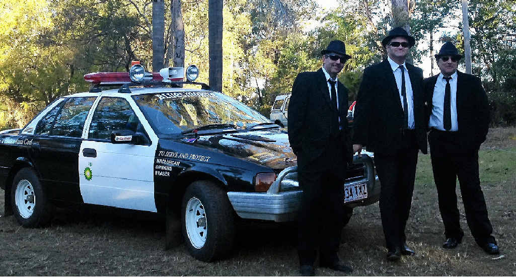 WHEELIE SCARY: Gavin and Carol Johnson with their Addams Family-inspired car.